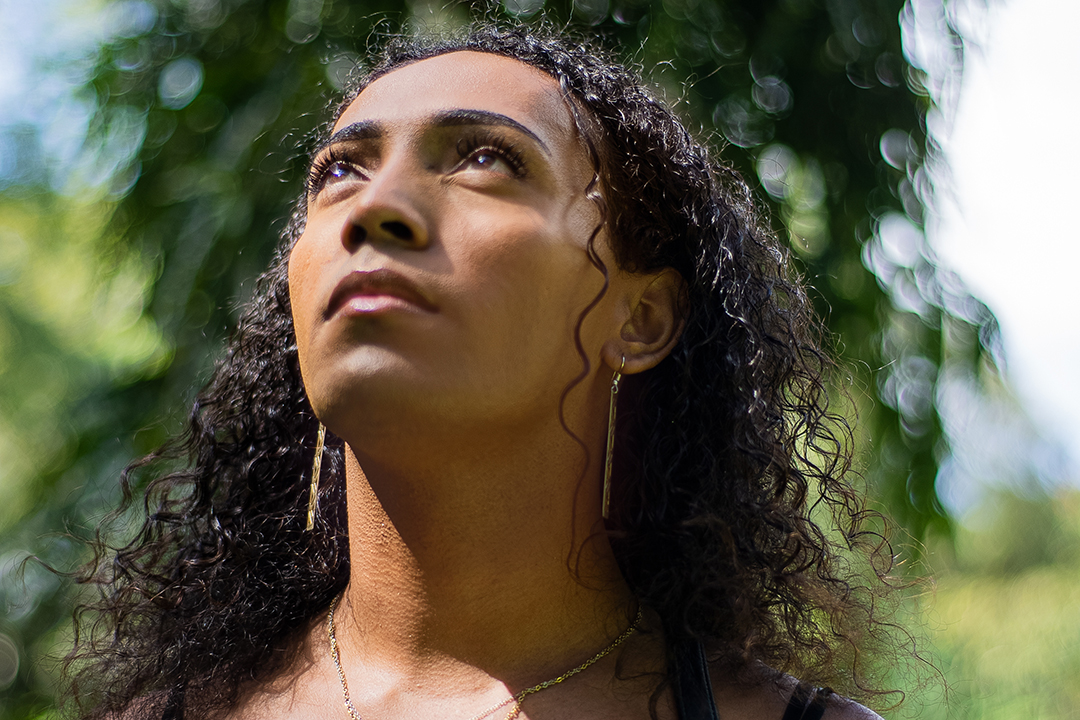 A young woman looking up into the sky